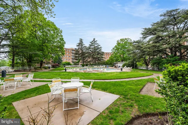 a view of a table and chairs in the garden