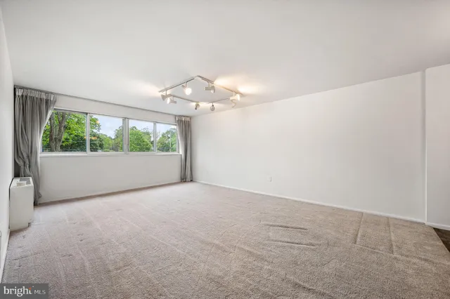 a view of a room with a large window