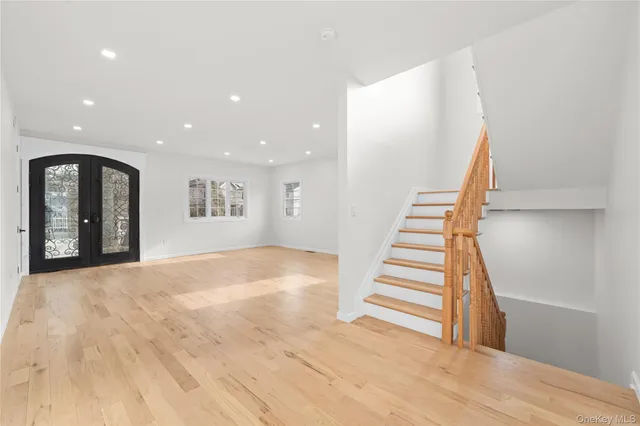 a view of entryway and hall with wooden floor