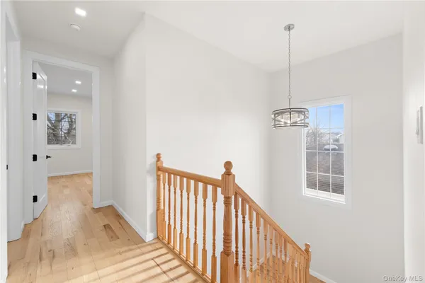a view of a hallway with windows