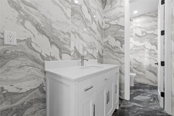 a bathroom with a sink and vanity