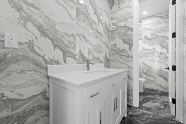 a bathroom with a sink and vanity