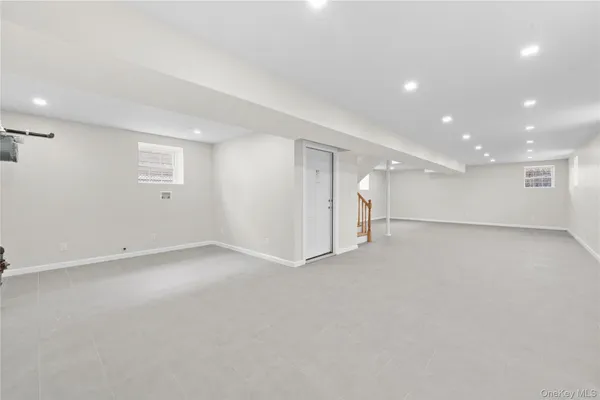 an empty room with a empty space and windows