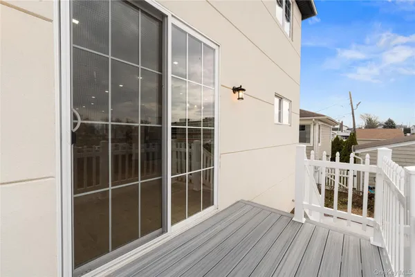 a view of front door deck and house