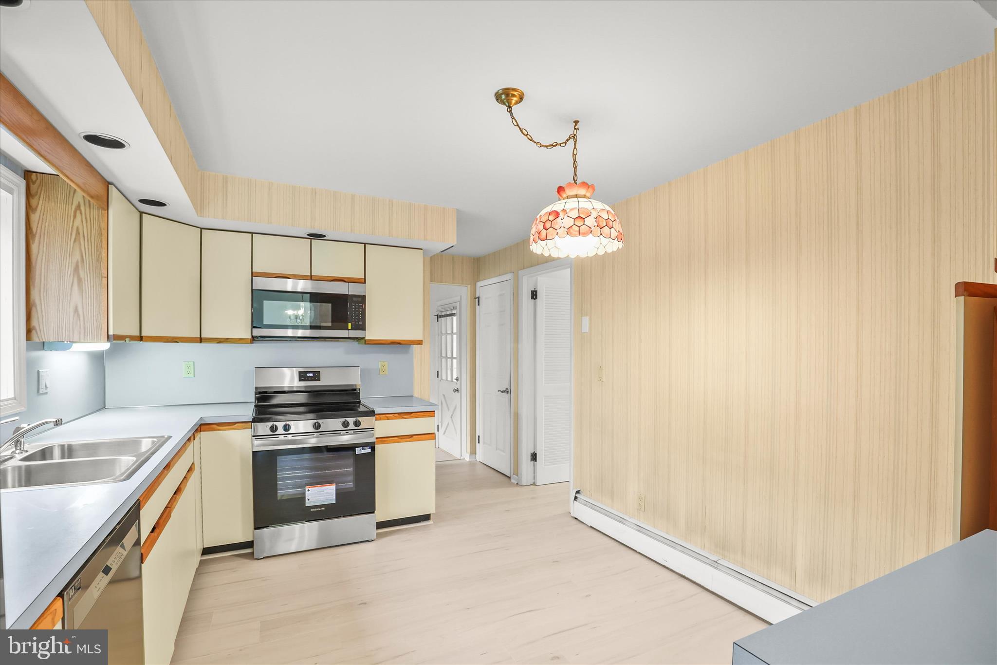 531 Rupley Road Camp Hill, PA 17011 - Photo 11 of 36 a kitchen with stainless steel appliances a stove a sink and white cabinets