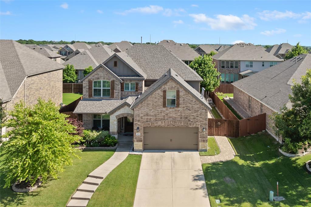 2417 Wrexham Drive McKinney, TX 75071 - Photo 1 of 40 a front view of a house with a yard