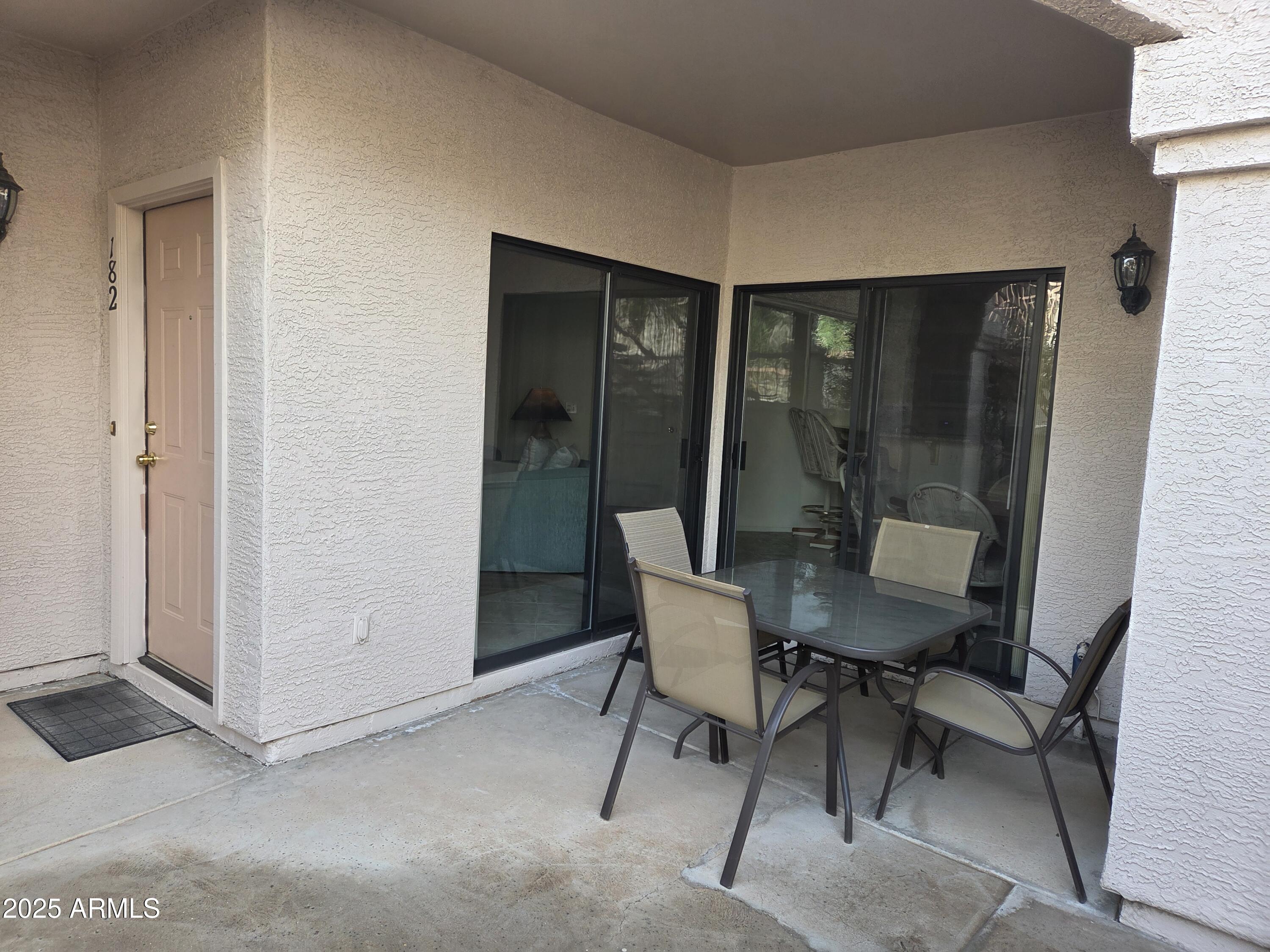 9151 West Greenway Road, Unit 182 Peoria, AZ 85381 - Photo 12 of 19 a view of a room with a table and chair