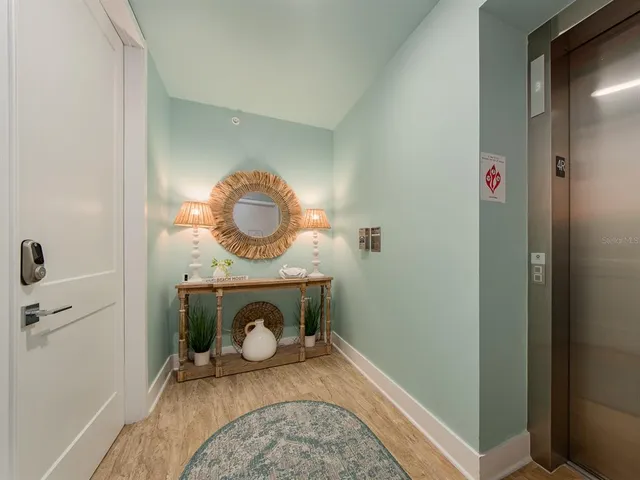 a view of a bedroom with a bed and a large window