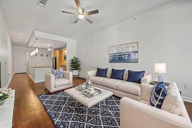 a living room with furniture and a rug