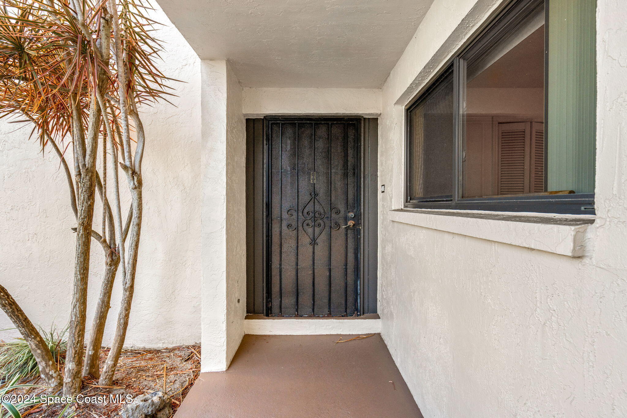 5807 North Atlantic Avenue, Unit 411 Cape Canaveral, FL 32920 - Photo 19 of 31 a view of wooden door