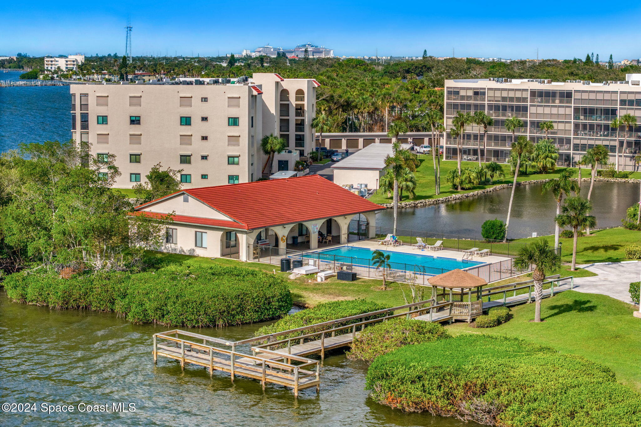5807 North Atlantic Avenue, Unit 411 Cape Canaveral, FL 32920 - Photo 23 of 31 an aerial view of residential houses and outdoor space