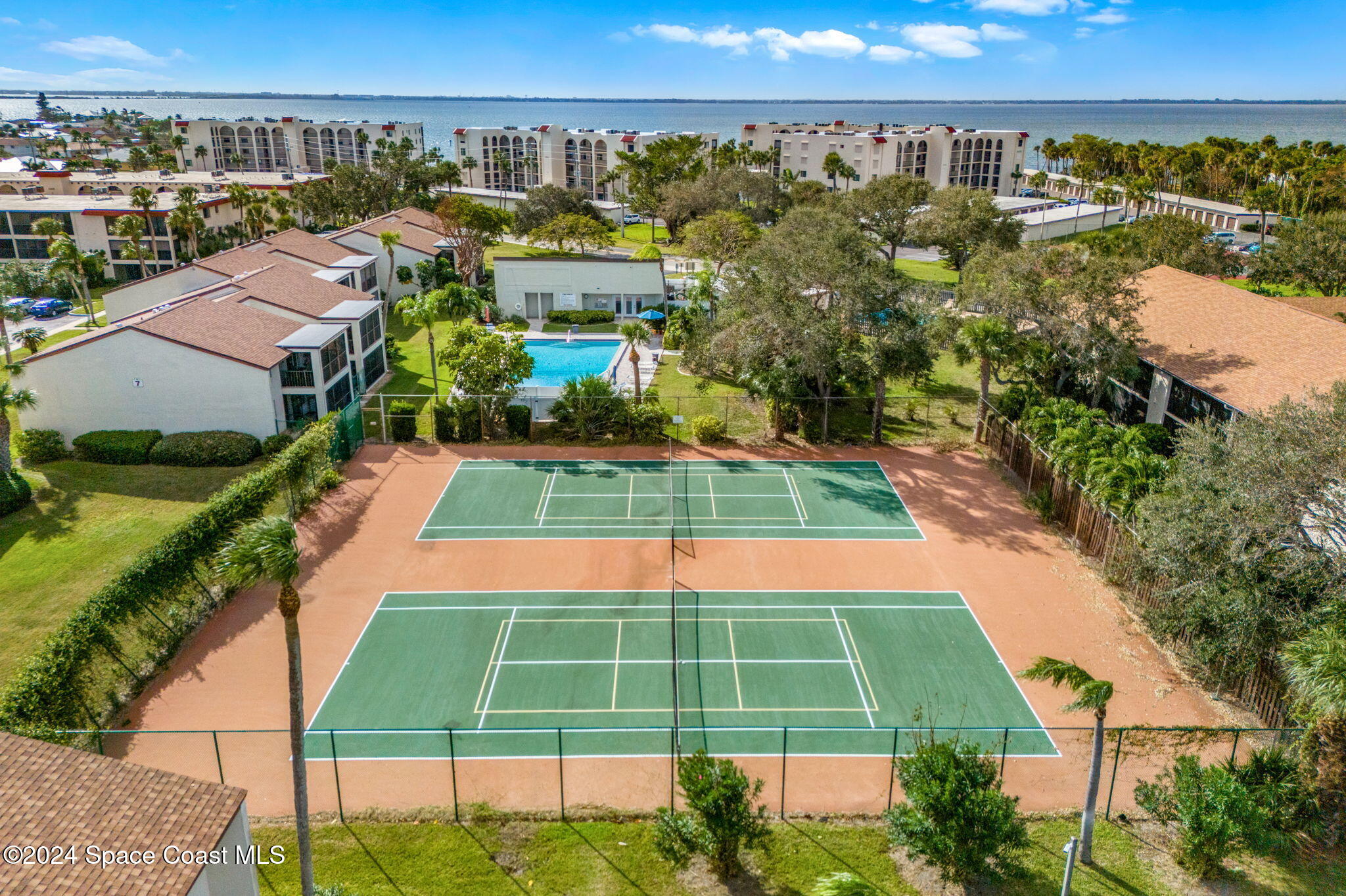 5807 North Atlantic Avenue, Unit 411 Cape Canaveral, FL 32920 - Photo 25 of 31 a view of a tennis court