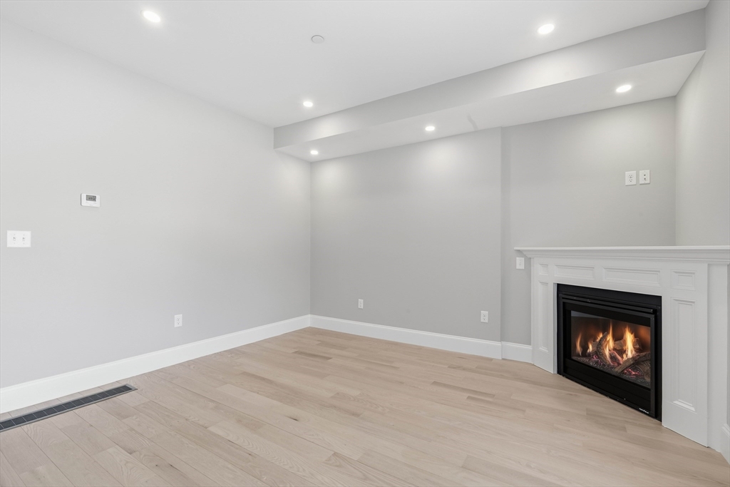 51 West Main Street, Unit 6R Georgetown, MA 01833 - Photo 15 of 40 a view of an empty room with a fireplace