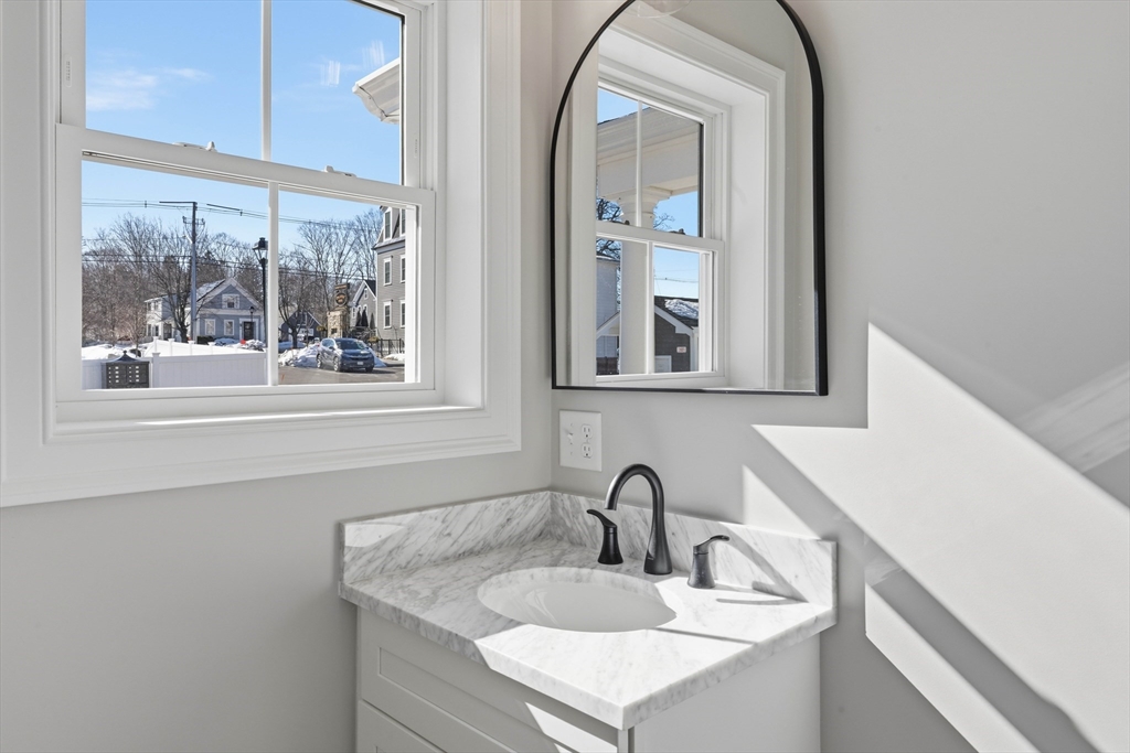 51 West Main Street, Unit 6R Georgetown, MA 01833 - Photo 17 of 40 a bathroom with a sink and a mirror