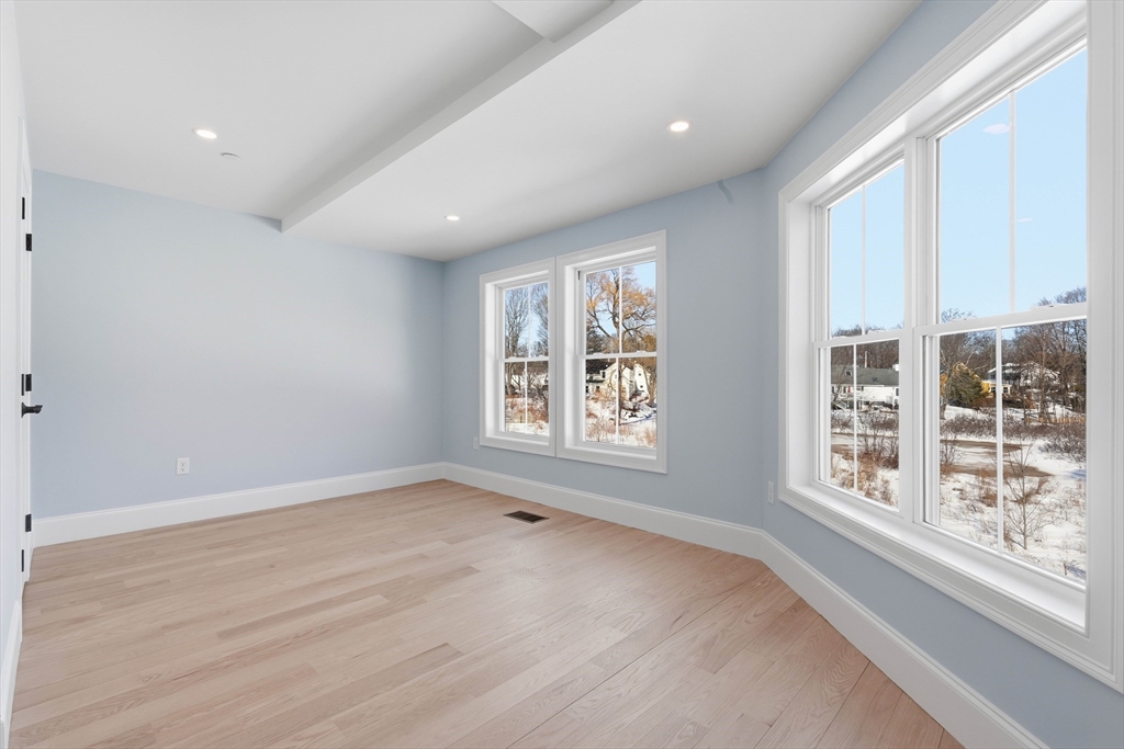 51 West Main Street, Unit 6R Georgetown, MA 01833 - Photo 19 of 40 an empty room with windows