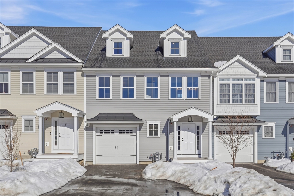 51 West Main Street, Unit 6R Georgetown, MA 01833 - Photo 2 of 40 a front view of a house with a yard