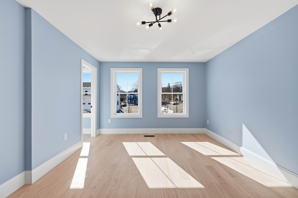 51 West Main Street, Unit 6R Georgetown, MA 01833 - Photo 26 of 40 a view of empty room with windows