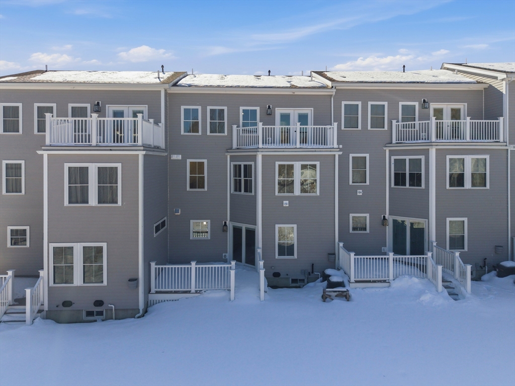 51 West Main Street, Unit 6R Georgetown, MA 01833 - Photo 3 of 40 a view of a building with a bench