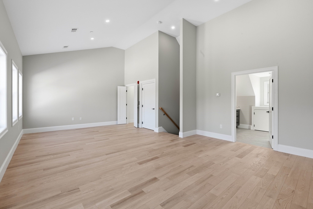 51 West Main Street, Unit 6R Georgetown, MA 01833 - Photo 34 of 40 a view of an empty room with wooden floor and a window