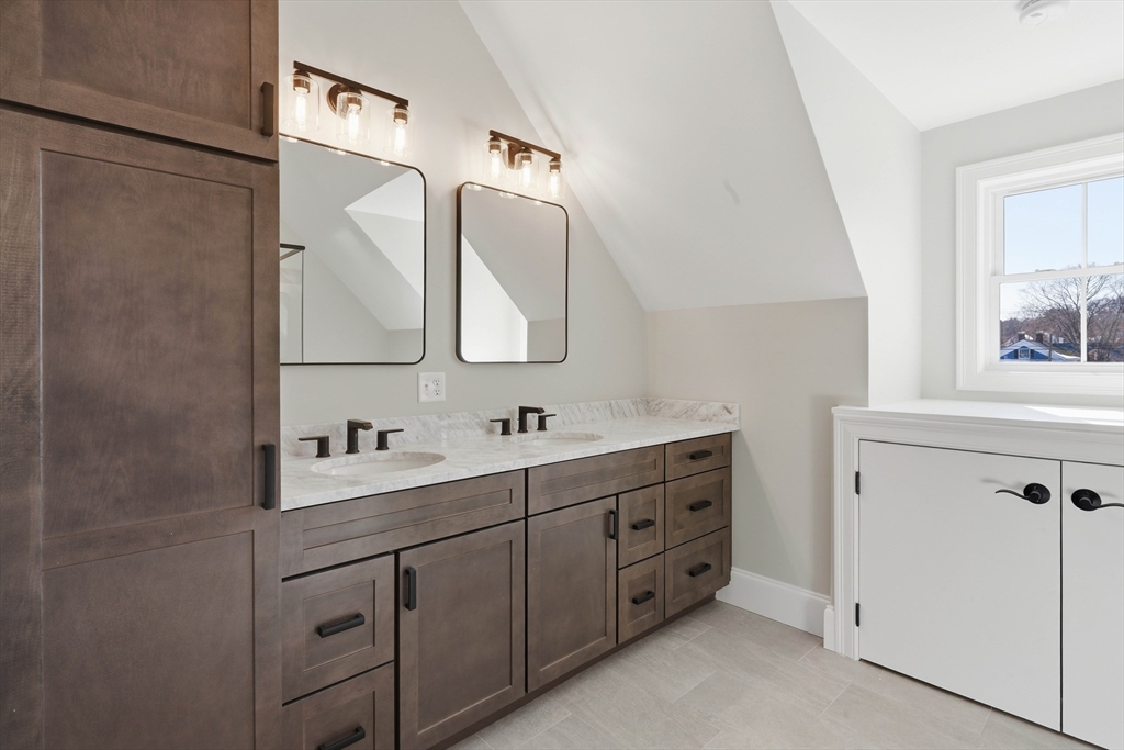 51 West Main Street, Unit 6R Georgetown, MA 01833 - Photo 35 of 40 a bathroom with a double vanity sink mirror and