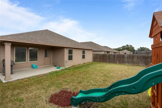 a childrens park with lots of swings and slides