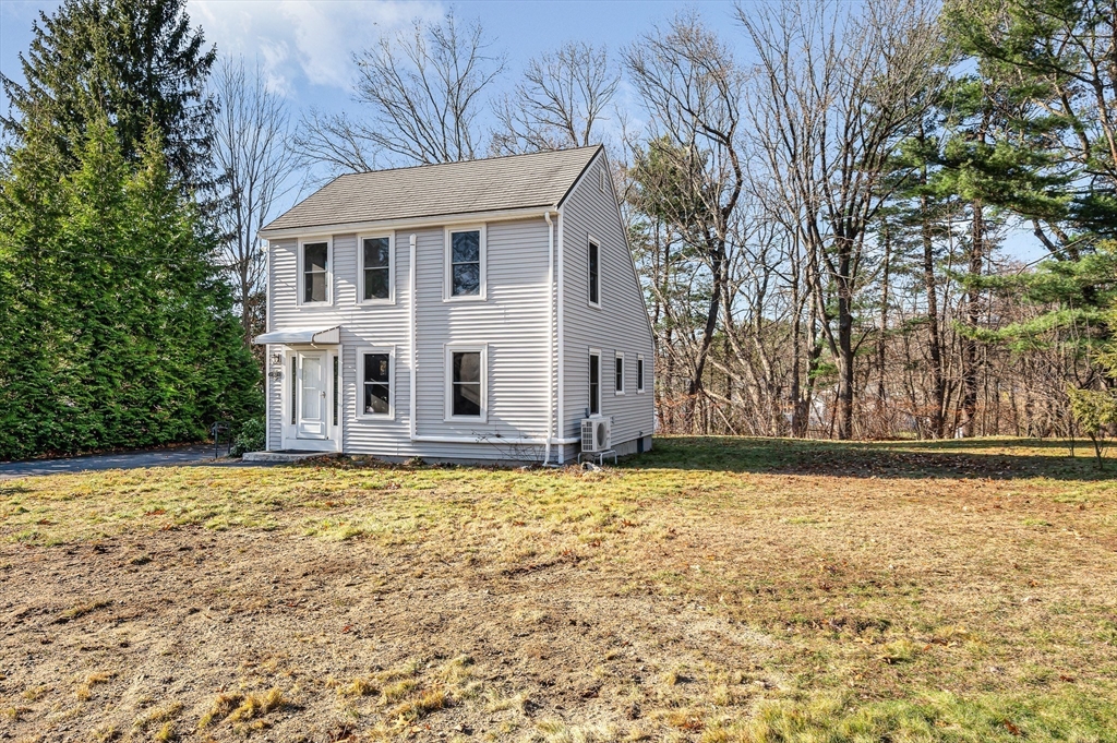 163 Water Street Framingham, MA 01701 - Photo 2 of 37 a view of a house with a yard