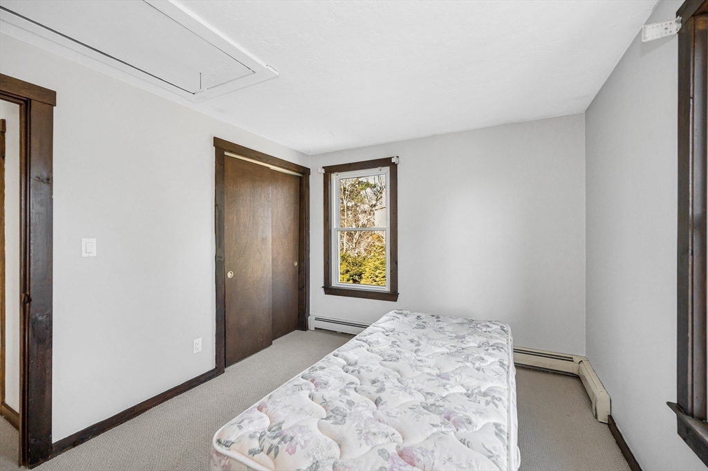 163 Water Street Framingham, MA 01701 - Photo 24 of 37 a bedroom with a bed and a window
