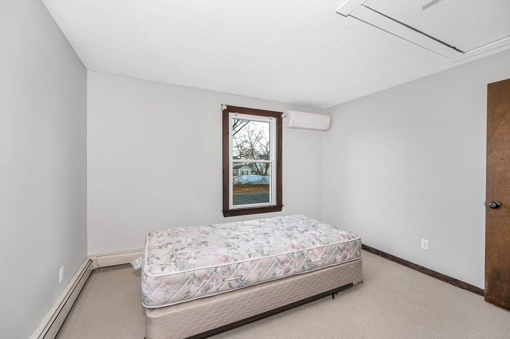163 Water Street Framingham, MA 01701 - Photo 26 of 37 a bedroom with a bed and a window
