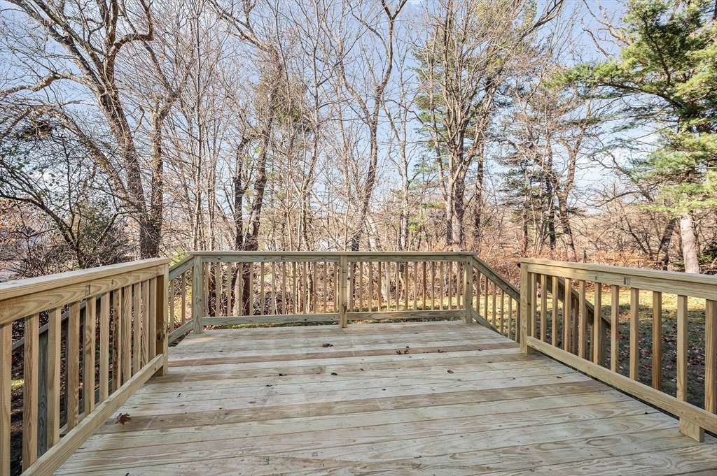 163 Water Street Framingham, MA 01701 - Photo 29 of 37 a porch with wooden floor and fence