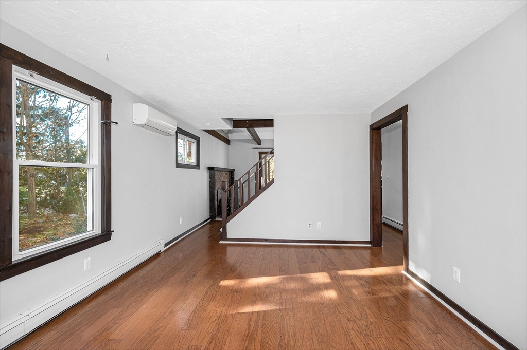 163 Water Street Framingham, MA 01701 - Photo 4 of 37 a view of entryway and hall with wooden floor