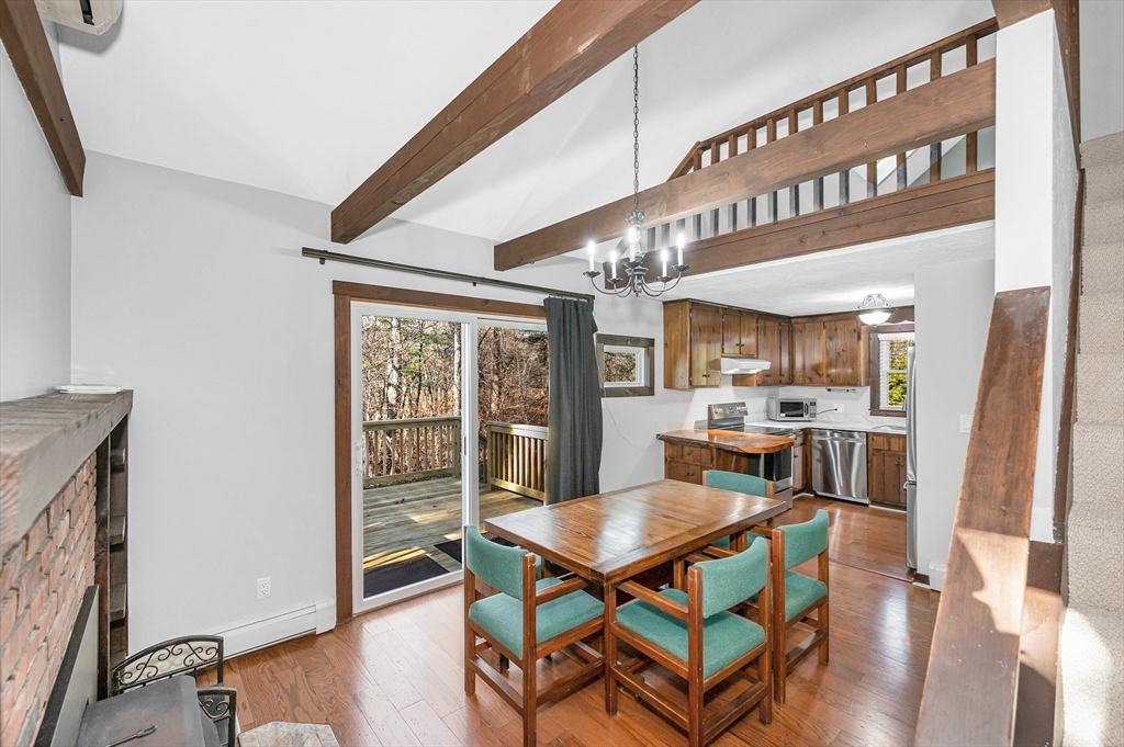 163 Water Street Framingham, MA 01701 - Photo 6 of 37 a view of a dining room with furniture window and wooden floor