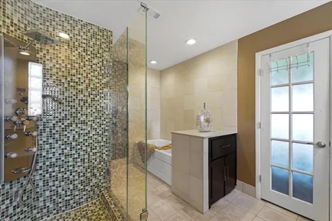 a bathroom with a shower and a sink