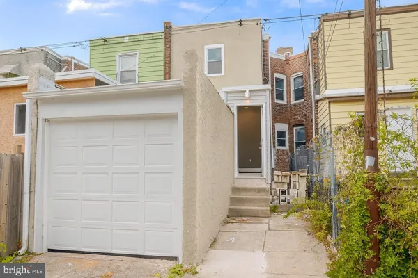 a view of a house with a door and a window
