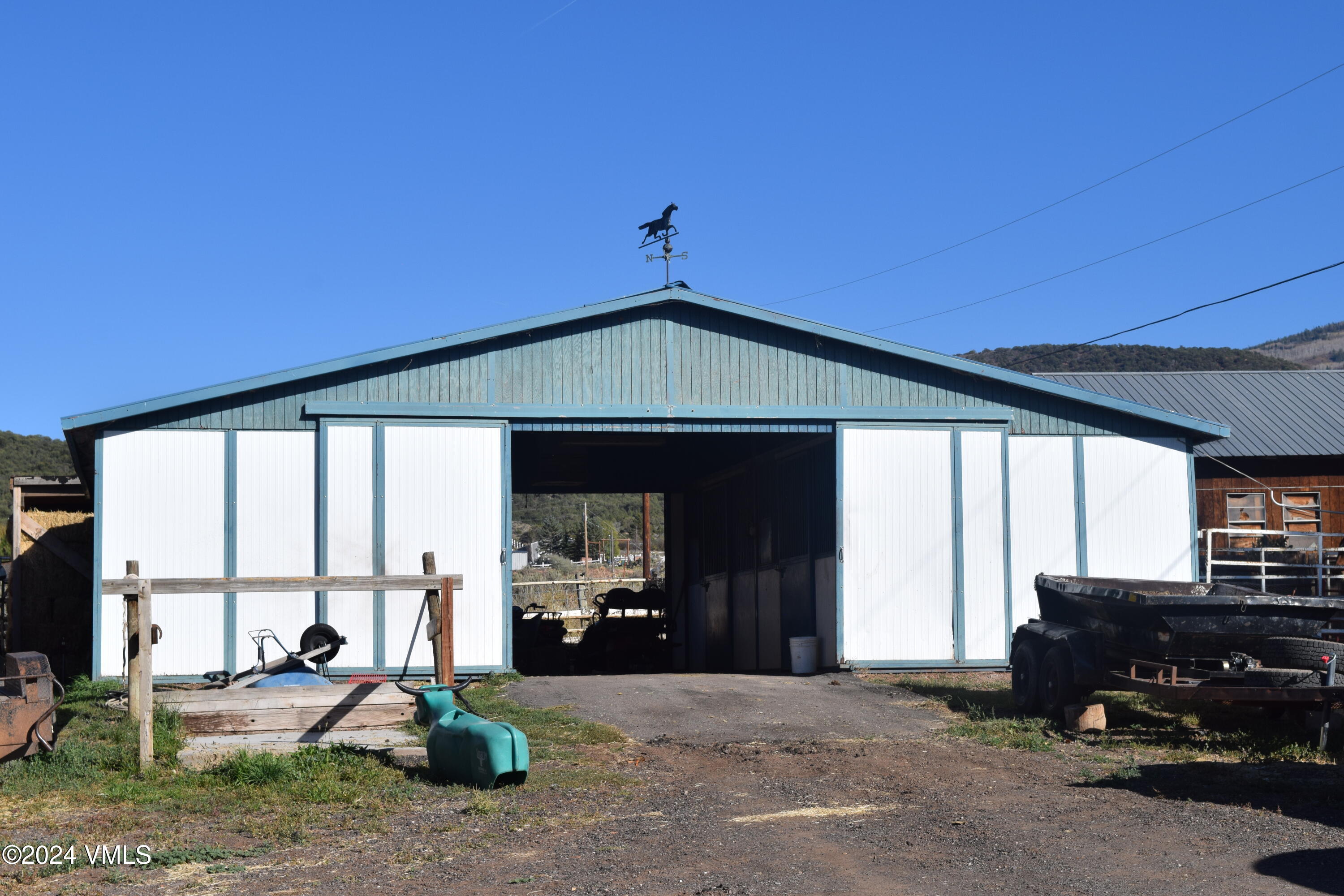 3536 Gypsum Creek Road Gypsum, CO 81637 - Photo 8 of 11 a living room with furniture and a floor to ceiling window