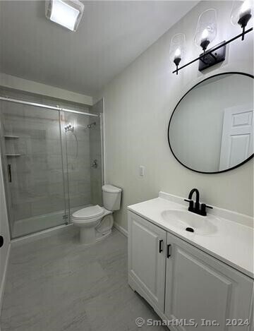 61 Colony Street, Unit 2C Meriden, CT 06451 - Photo 7 of 9 a bathroom with a sink a toilet and shower