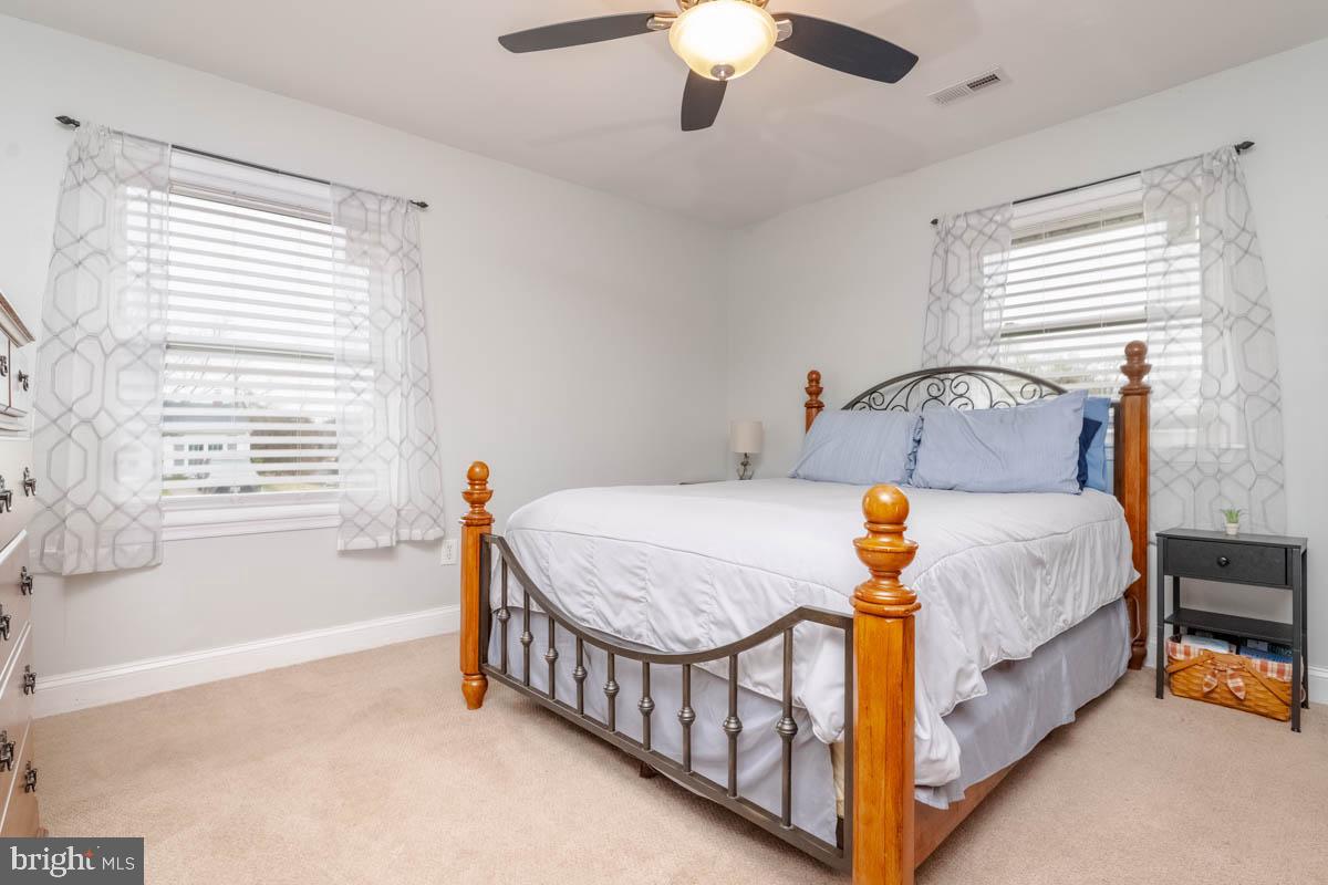 414 Enfield Road Joppa, MD 21085 - Photo 14 of 42 a bed sitting in a bedroom next to a window