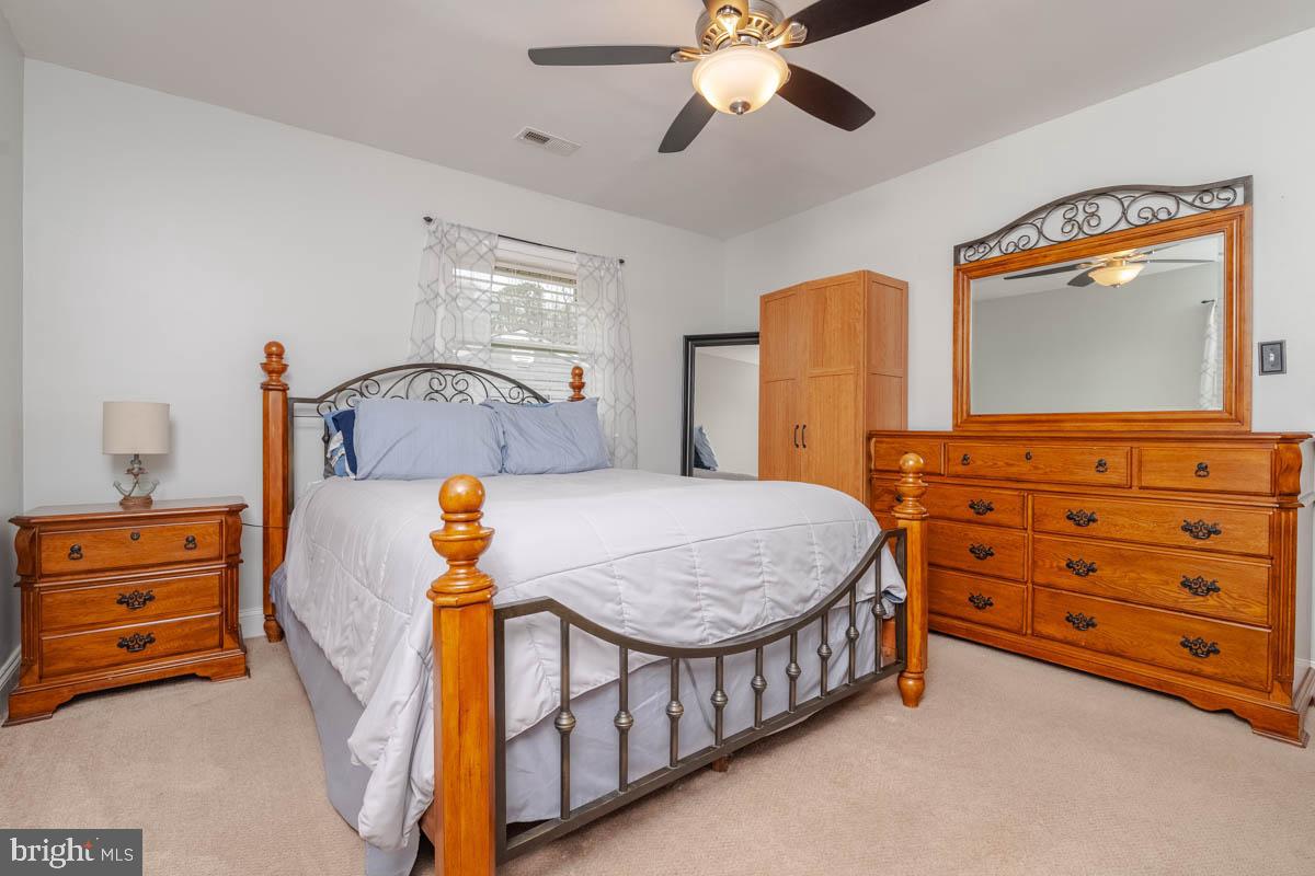 414 Enfield Road Joppa, MD 21085 - Photo 15 of 42 a bedroom with a bed and a dresser