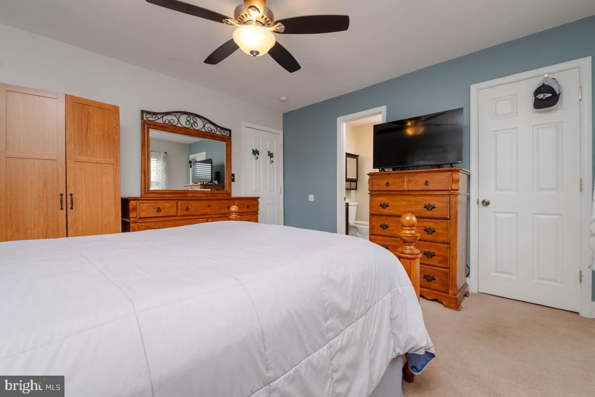 414 Enfield Road Joppa, MD 21085 - Photo 16 of 42 a bedroom with a bed and a flat screen tv