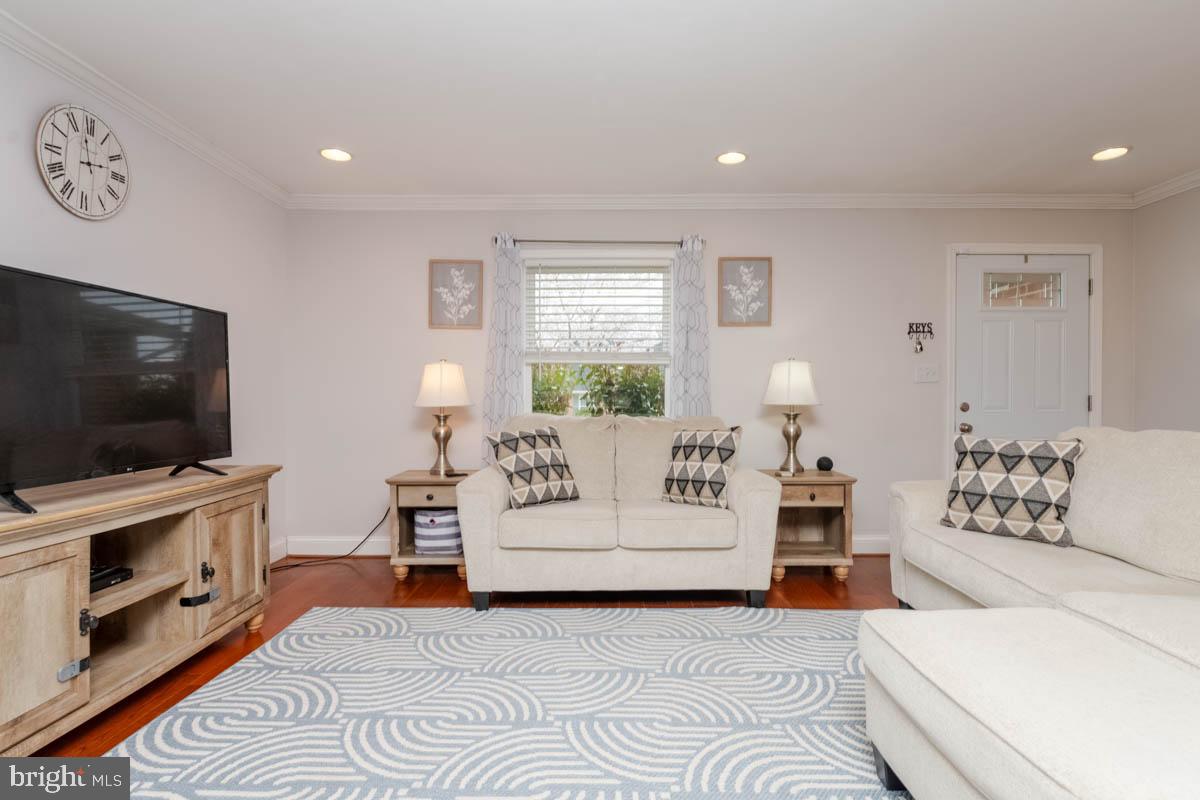 414 Enfield Road Joppa, MD 21085 - Photo 2 of 42 a living room with furniture and a flat screen tv