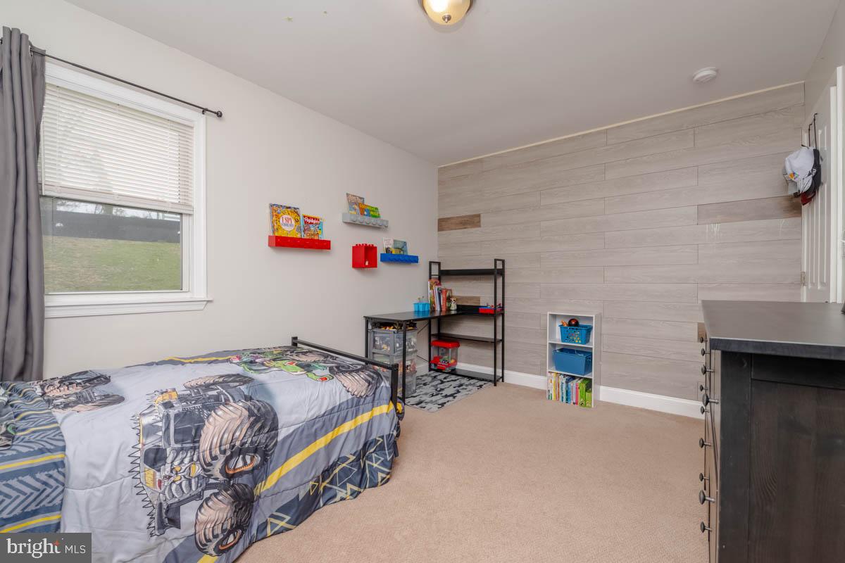 414 Enfield Road Joppa, MD 21085 - Photo 25 of 42 a bedroom with a bed a table and windows