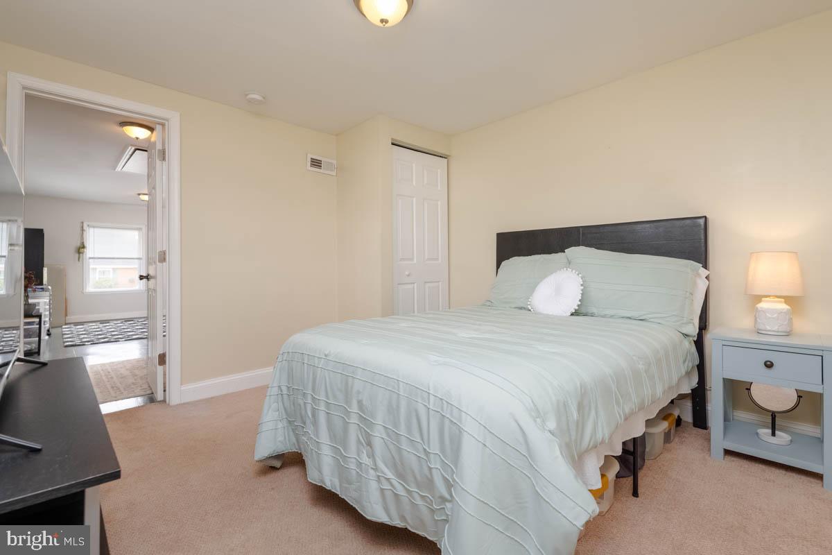 414 Enfield Road Joppa, MD 21085 - Photo 28 of 42 a bedroom with a bed and a couch