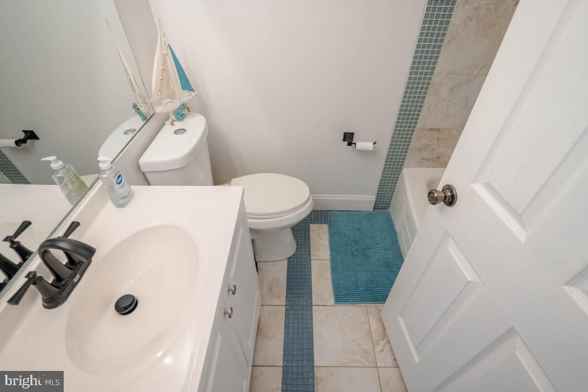 414 Enfield Road Joppa, MD 21085 - Photo 31 of 42 a bathroom with a sink and toilet