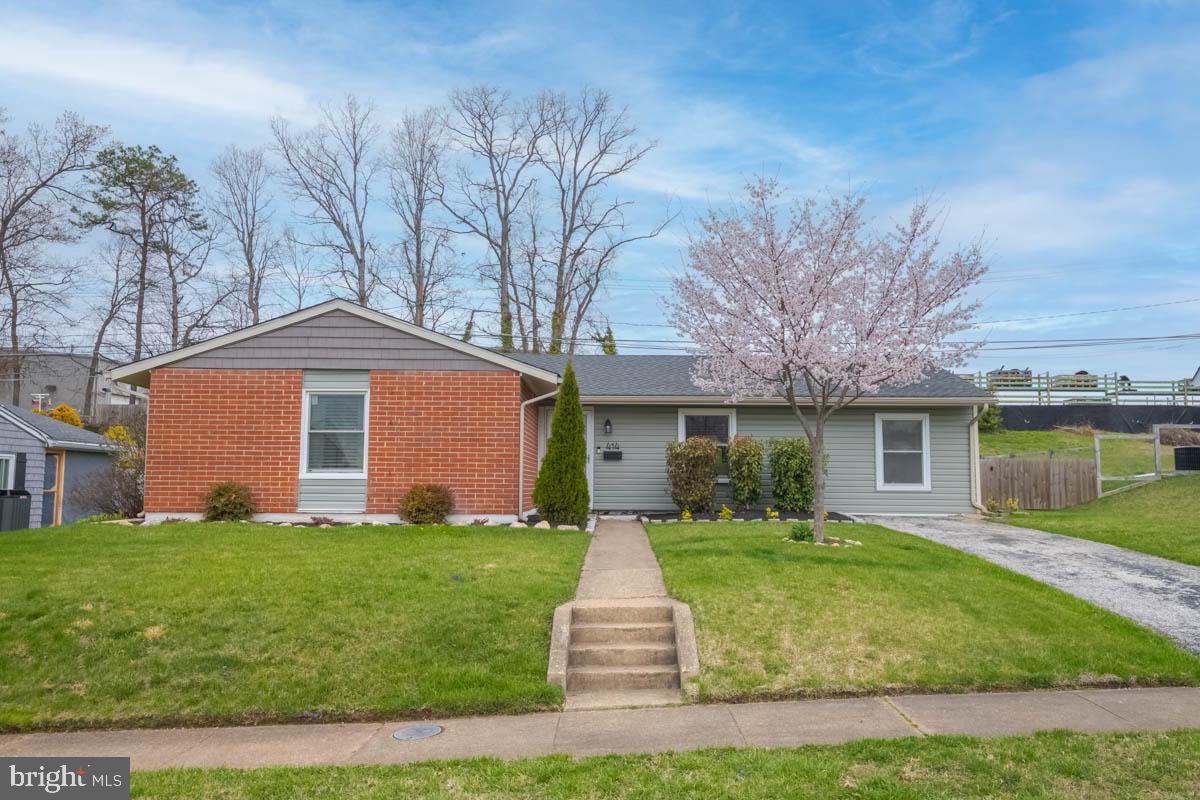 414 Enfield Road Joppa, MD 21085 - Photo 42 of 42 a front view of a house with garden