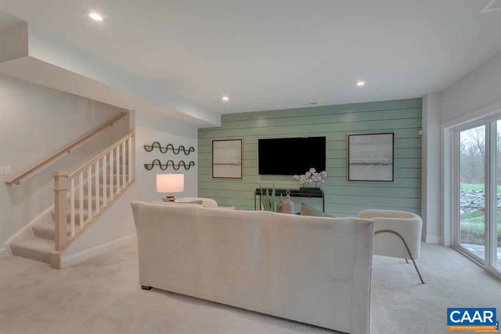 2837 Rambling Brook Lane Crozet, VA 22932 - Photo 23 of 24 a living room with furniture and a flat screen tv