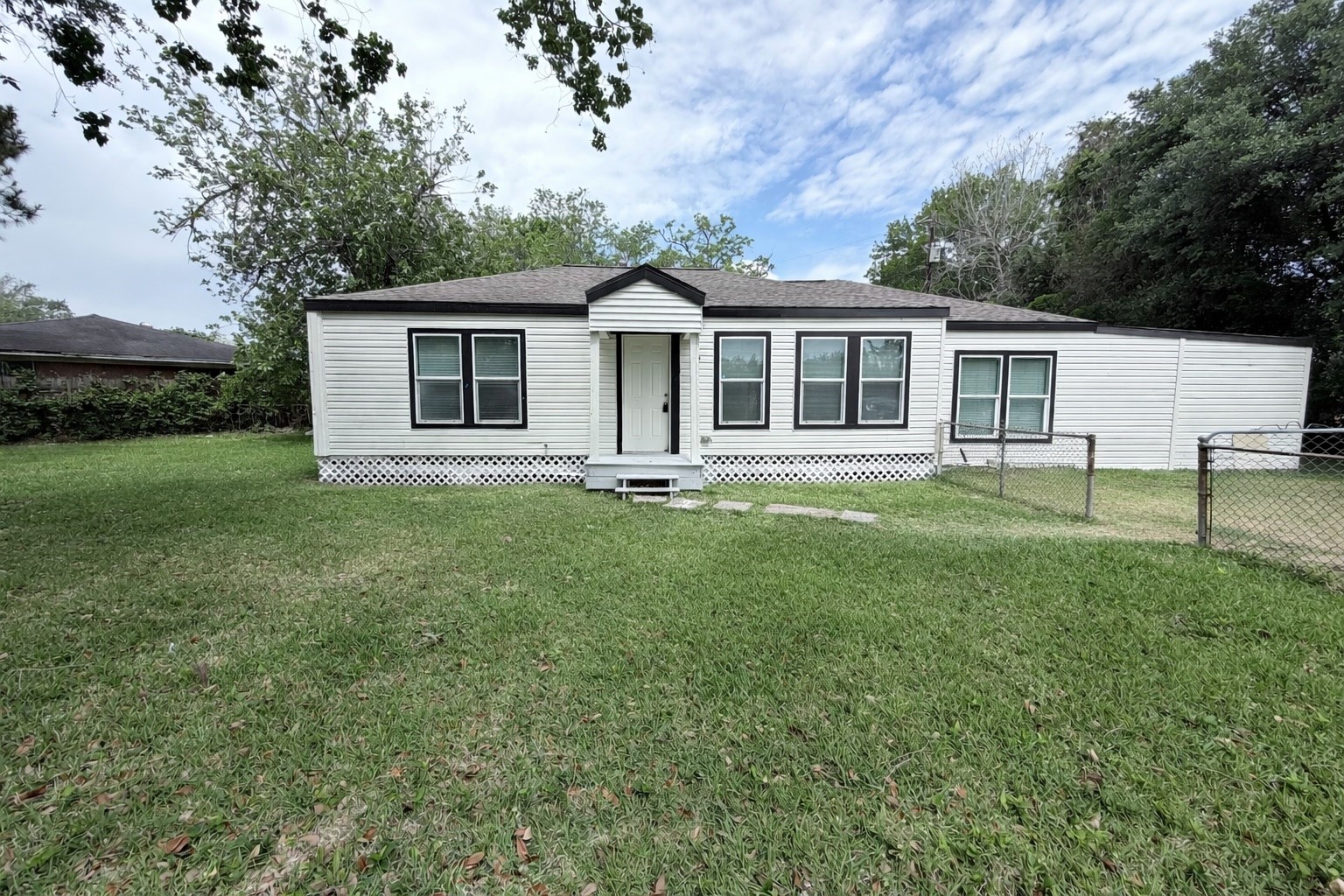 1112 3rd Street La Marque, TX 77568 - Photo 1 of 21 a front view of house with yard and green space
