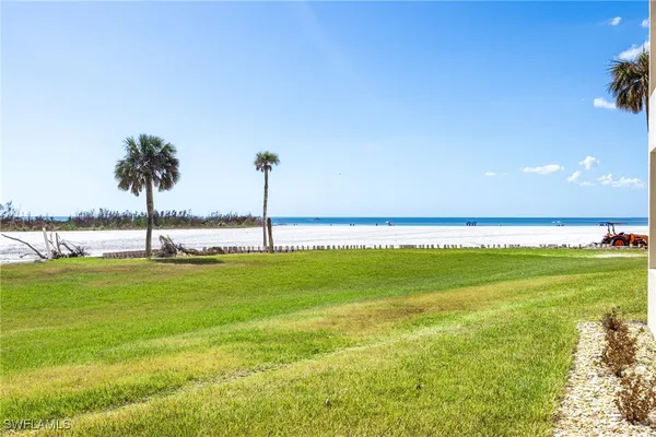 a view of an ocean and a yard