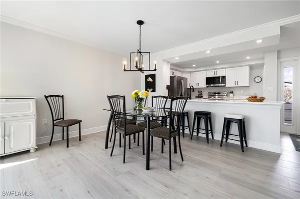 a view of a dining room with furniture and wooden floor