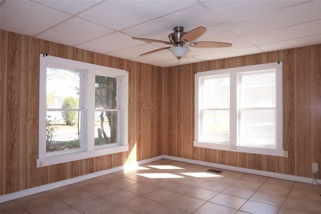 5353 10th Street Zephyrhills, FL 33542 - Photo 12 of 26 a view of an empty room and window ceiling fan