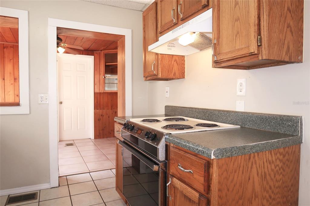 5353 10th Street Zephyrhills, FL 33542 - Photo 15 of 26 a kitchen with a stove and a sink