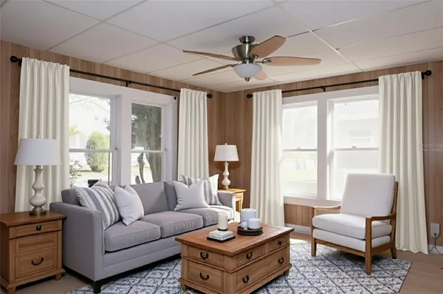 a living room with furniture and a large window